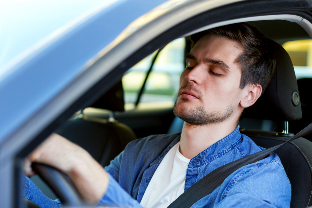 Drive a car sleep. Сонный водитель. Сонный человек за рулем на белом фоне. A man Falling asleep at the Wheel. Tired man next to the car.