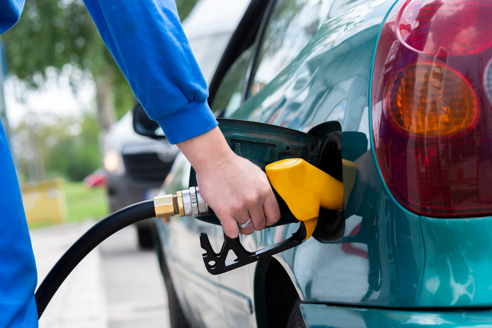 Fill the car. Бензин топливо. Man fill gasoline can on Gas Station.